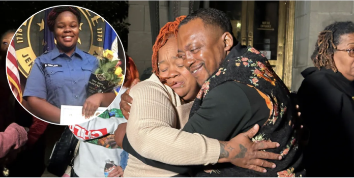 Breonna Taylor’s mother, Tamika Palmer, center left, hugs a friend.